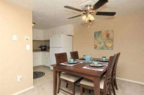 Warwick apartment for rent - a dining room table with chairs and a ceiling fan