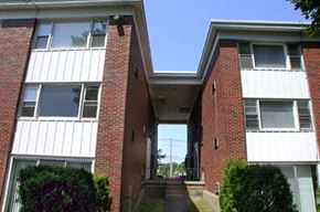 Cranston apartment for rent - the front of a brick house with a covered walkway