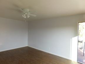 San Diego apartment for rent - an empty living room with a ceiling fan
