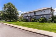 Middletown apartment for rent - a white house with a sidewalk and lawn in front of it