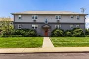 Middletown apartment for rent - a gray house with a red door and a lawn