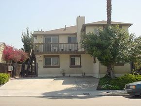 San Diego apartment for rent - A house with a car parked in front.