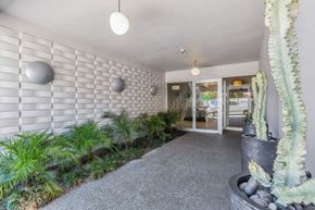 San Francisco apartment for rent - a courtyard with plants and a white brick wall