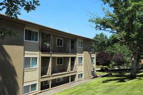 Coventry apartment for rent - an apartment building with a lawn and trees