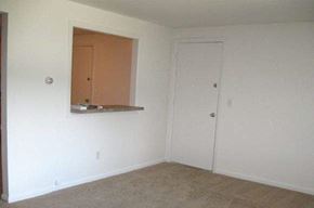 Coventry apartment for rent - an empty living room with a window and a door