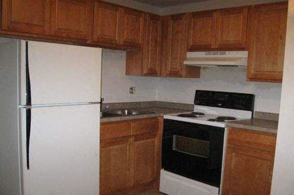 Coventry apartment for rent - a kitchen with a stove and a refrigerator