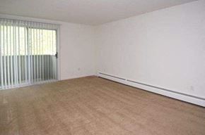 West Warwick apartment for rent - an empty living room with white walls and a large window