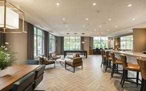East Walpole apartment for rent - a clubhouse with a bar and tables and chairs