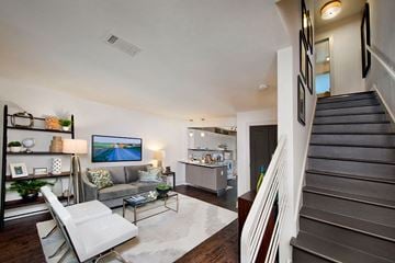 Atlanta apartment for rent - a living room with a couch and a staircase