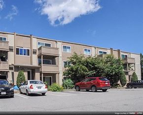 Warwick apartment for rent - an apartment building with cars parked in a parking lot