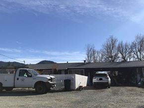 Hayfork apartment for rent - a truck and a car parked in front of a house