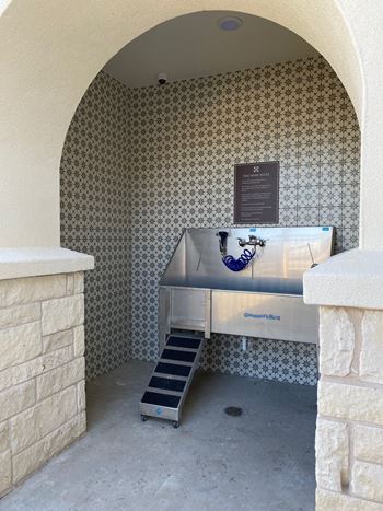 Dog wash station with stainless steel tub and stairs