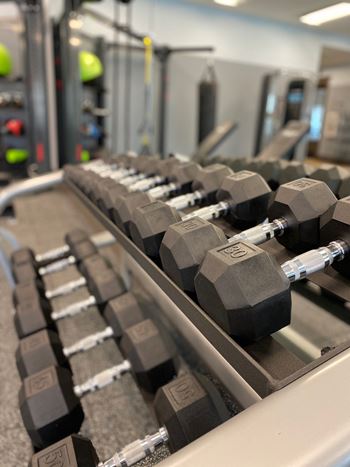 Fitness center with dumbbell rack and free weights