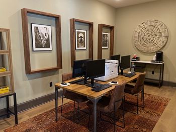 Business center with computers and vintage wall art