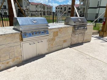 Outdoor grilling stations with built in barbecues
