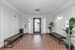 San Francisco apartment for rent - A hallway with a bench and a plant.