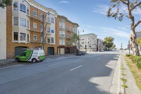San Francisco apartment for rent - A street view with a green van parked on the side.