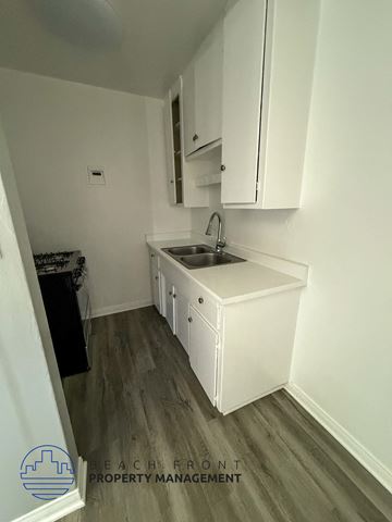 Anaheim apartment for rent - A small kitchen with a sink and cabinets.
