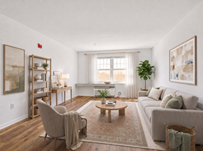 Gwynn Oak apartment for rent - A living room with a grey couch, a wooden coffee table, a chair, and a rug.