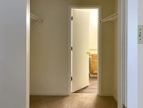 Mobile apartment for rent - closet area with doorway to bathroom