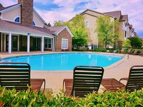 Muscogee Columbus apartment for rent - The sparkling pool and large sundeck by the clubhouse at Lumpkin Park Apartments