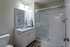 Lawrence apartment for rent - a bathroom with a shower and a sink and a toilet