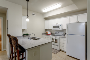 Lawrence apartment for rent - a kitchen with white cabinets and appliances and a counter top