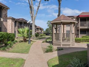 Houston apartment for rent - a gazebo sits in the middle of a sidewalk
