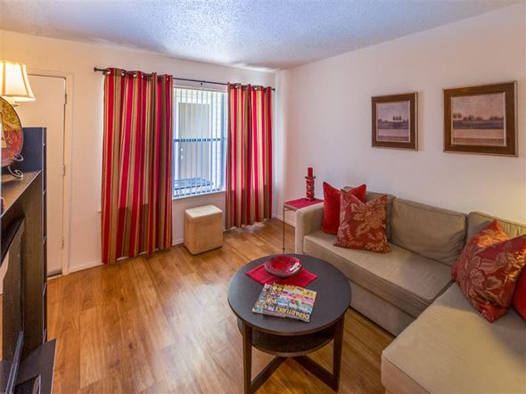 Dallas apartment for rent - a living room with a couch and a table