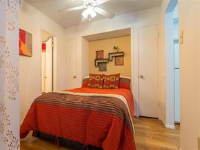 Dallas apartment for rent - a bedroom with a bed and a ceiling fan
