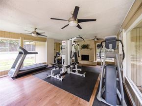 Austin apartment for rent - the gym in the home has a ceiling fan and exercise equipment