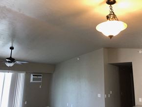 Sister Bay apartment for rent - a light fixture and a ceiling fan in a living room
