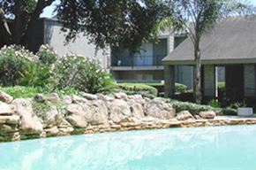 Houston apartment for rent - a house with a swimming pool in front of it
