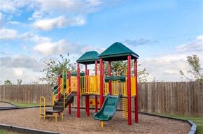 Houston apartment for rent - a childrens playground with a swing set