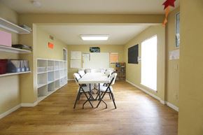 Dallas apartment for rent - a dining room with a white table and chairs