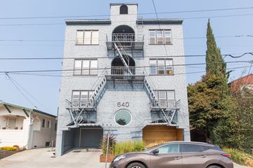 Oakland apartment for rent - A grey building with the number 640 on it.