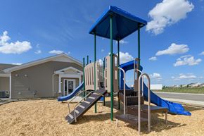 London apartment for rent - the preserve at ballantyne commons playground with play equipment and a building