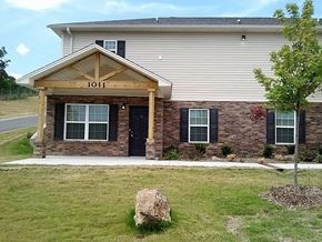 North Little Rock apartment for rent - a house with a porch and a rock in front of it