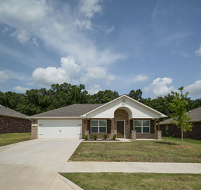 Tahlequah apartment for rent - a house with a driveway and a lawn