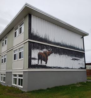 Thompson apartment for rent - A building with a moose painting on the side.