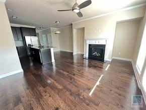 Atlanta house for rent - an empty living room with a fireplace and a kitchen