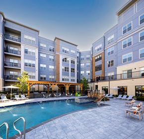 Malden apartment for rent - a swimming pool in front of an apartment building