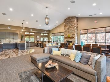 Plymouth townhouse for rent - a large living room with couches and a table