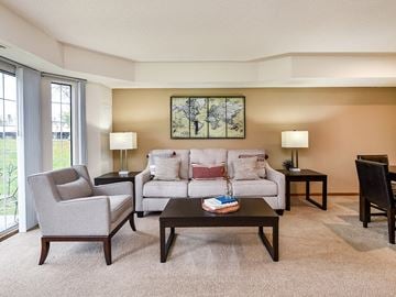 White Bear Lake townhouse for rent - a living room with a couch and chairs and a table
