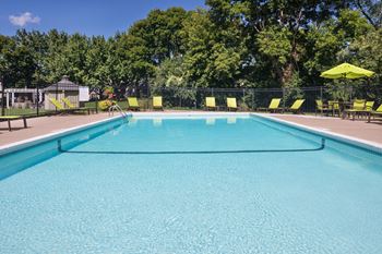 Outdoor heated swimming pool with sundeck