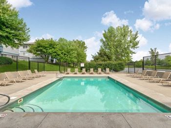 Outdoor, heated swimming pool with sundeck