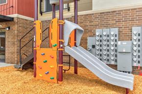Fargo apartment for rent - a slide at a playground in a building