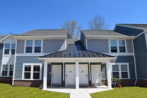 Little Egg Harbor Township apartment for rent - a blue house with a black roof on a sunny day