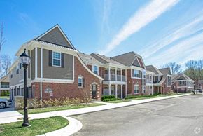 Shelby Twp apartment for rent - a row of brick houses on the side of a street