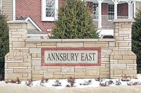 Shelby Twp apartment for rent - a stone wall with a sign that reads amsbury east